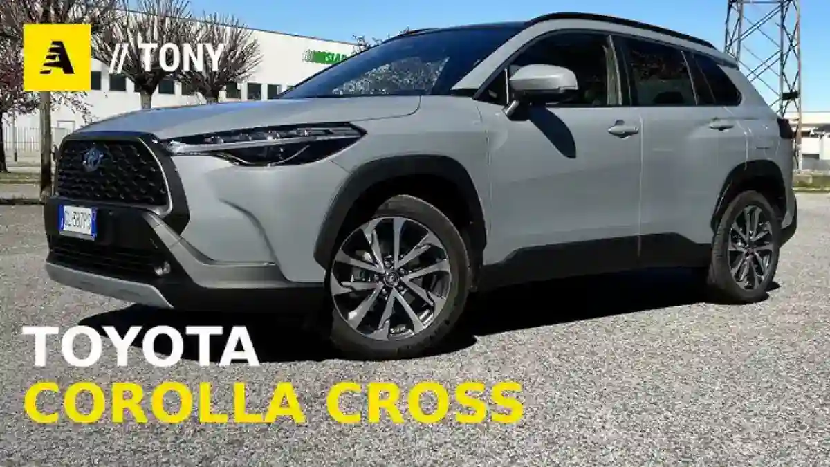 SUV Toyota Corolla Cross in sleek gray color parked outdoors, showcasing modern design and features.